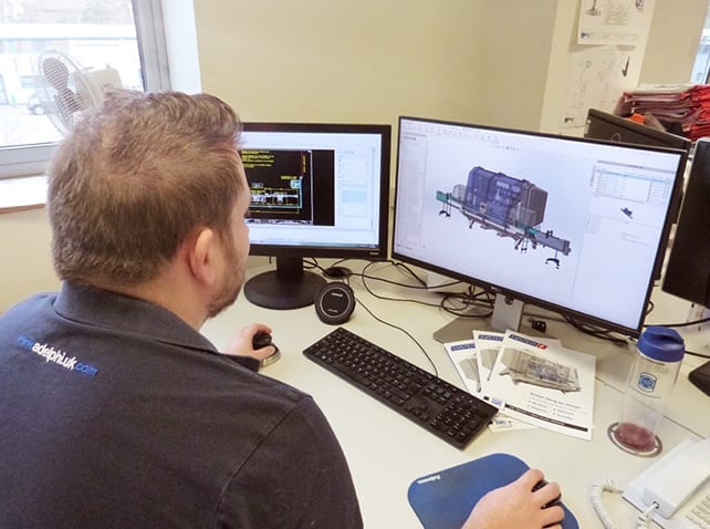 Adelphi engineer developing machinery on a computer screen